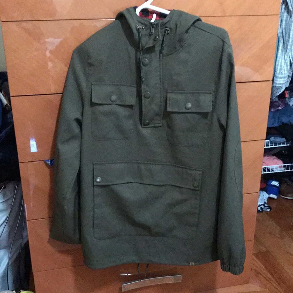 Army green jacket with red flannel inside